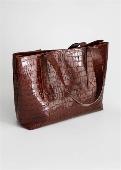 crocodile embossed tote bag.